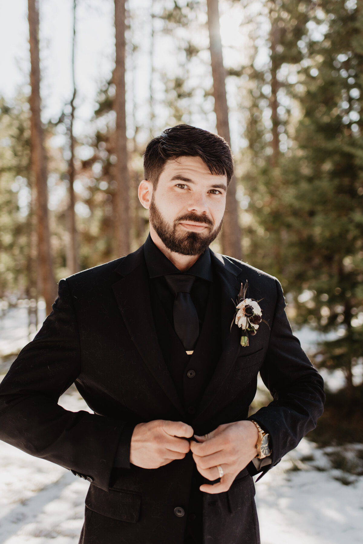 Jackson Hole Photographers capture groom buttoning jacket