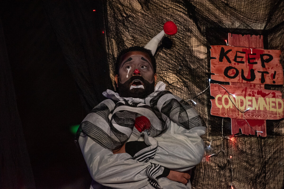 A person in a costume performing during a play