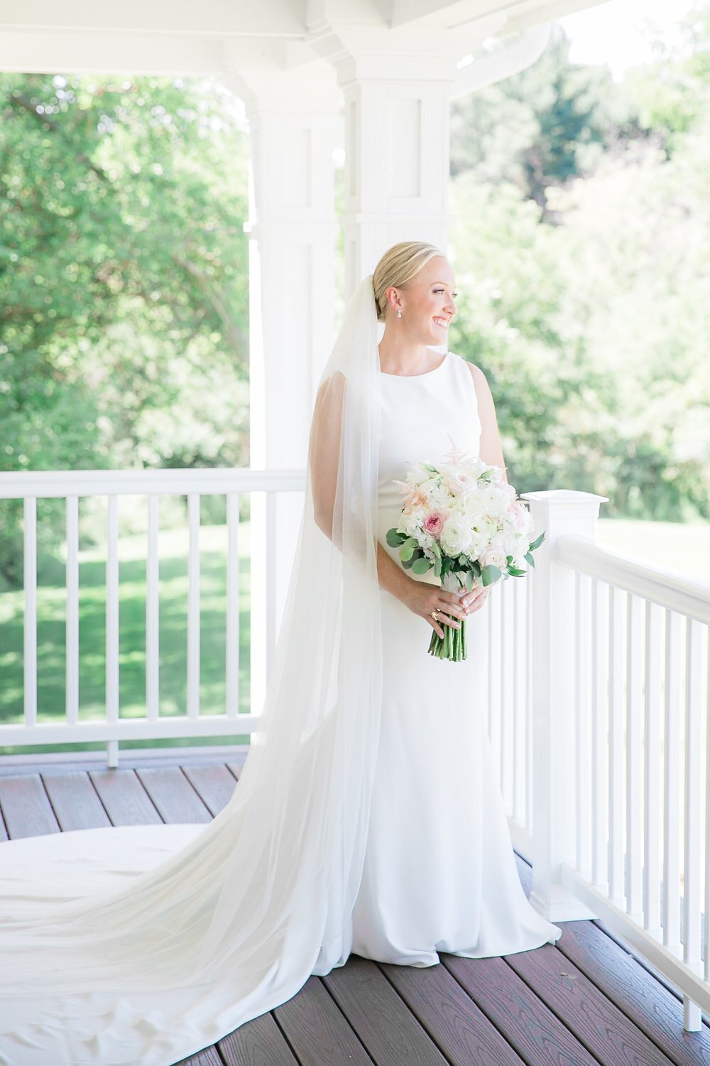 Bride poses with her flowers at a private residence in Columbus Ohio