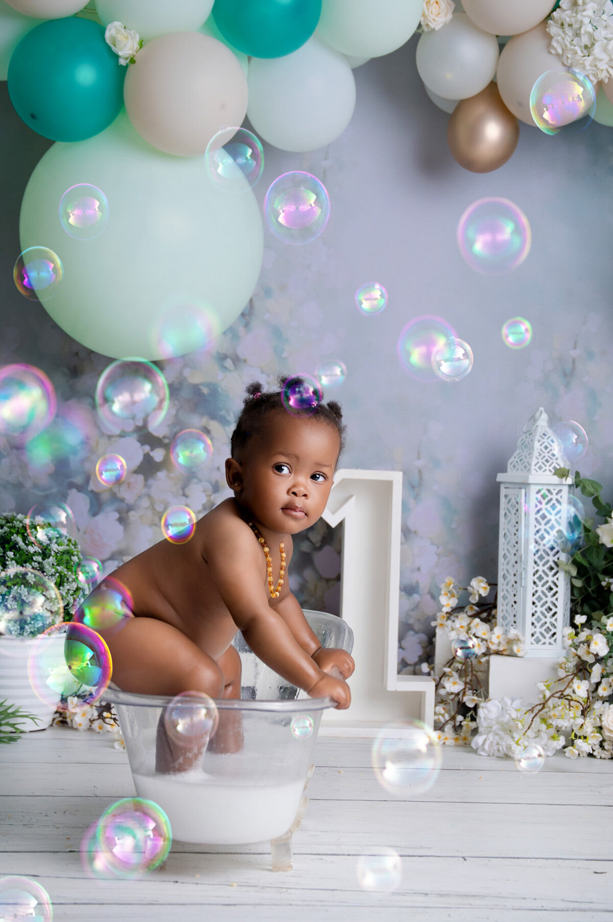 one year old having her milkbath during cake smash photoshoot