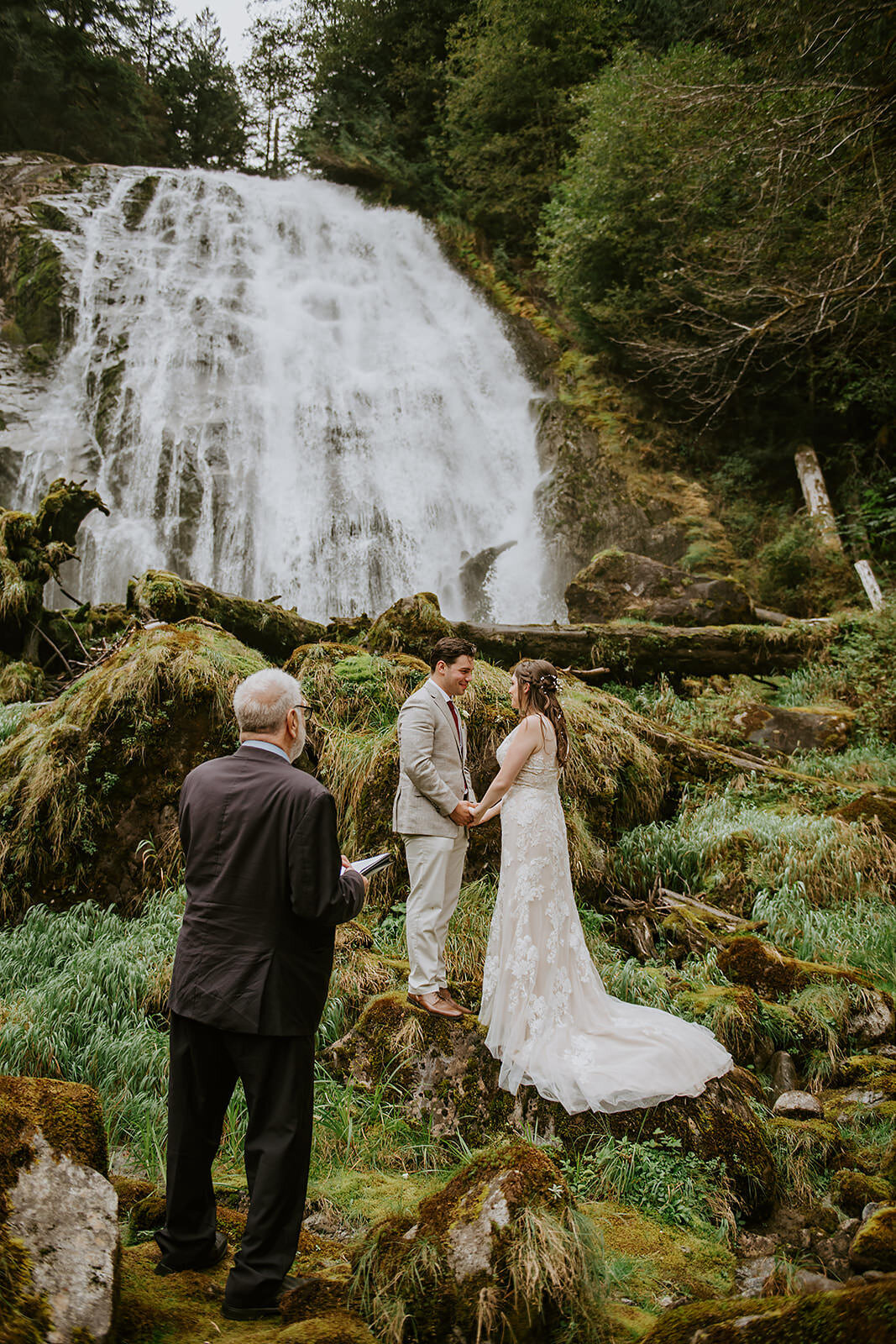 Couple during their ceremony under a waterfall during their Sunshine Coast B.C Elopement.