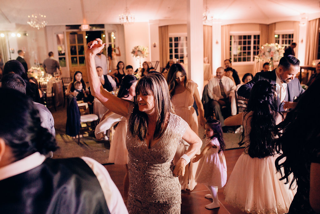 Wedding Photograph Of Women In Peach Dresses Dancing Los Angeles