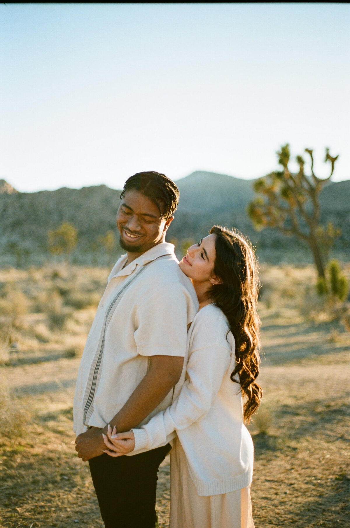 engagement photo of a couple in Joshua Tree, CA captured by Los Angeles film wedding photographer