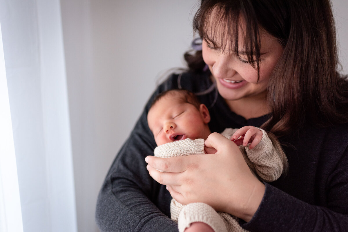 mom and son at window natural light wrapped newborn bluffton indiana northeast IN fort wayne newbron photographer baby photography