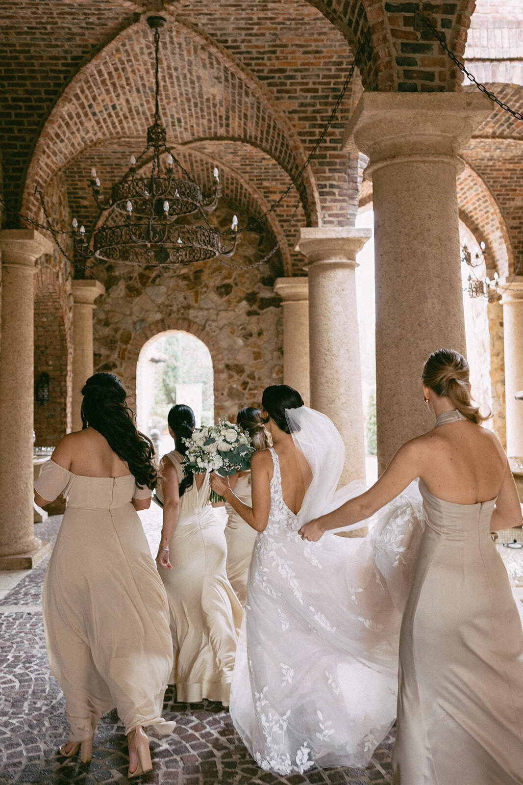 bridesmaids walking at bella collina orlando wedding​
