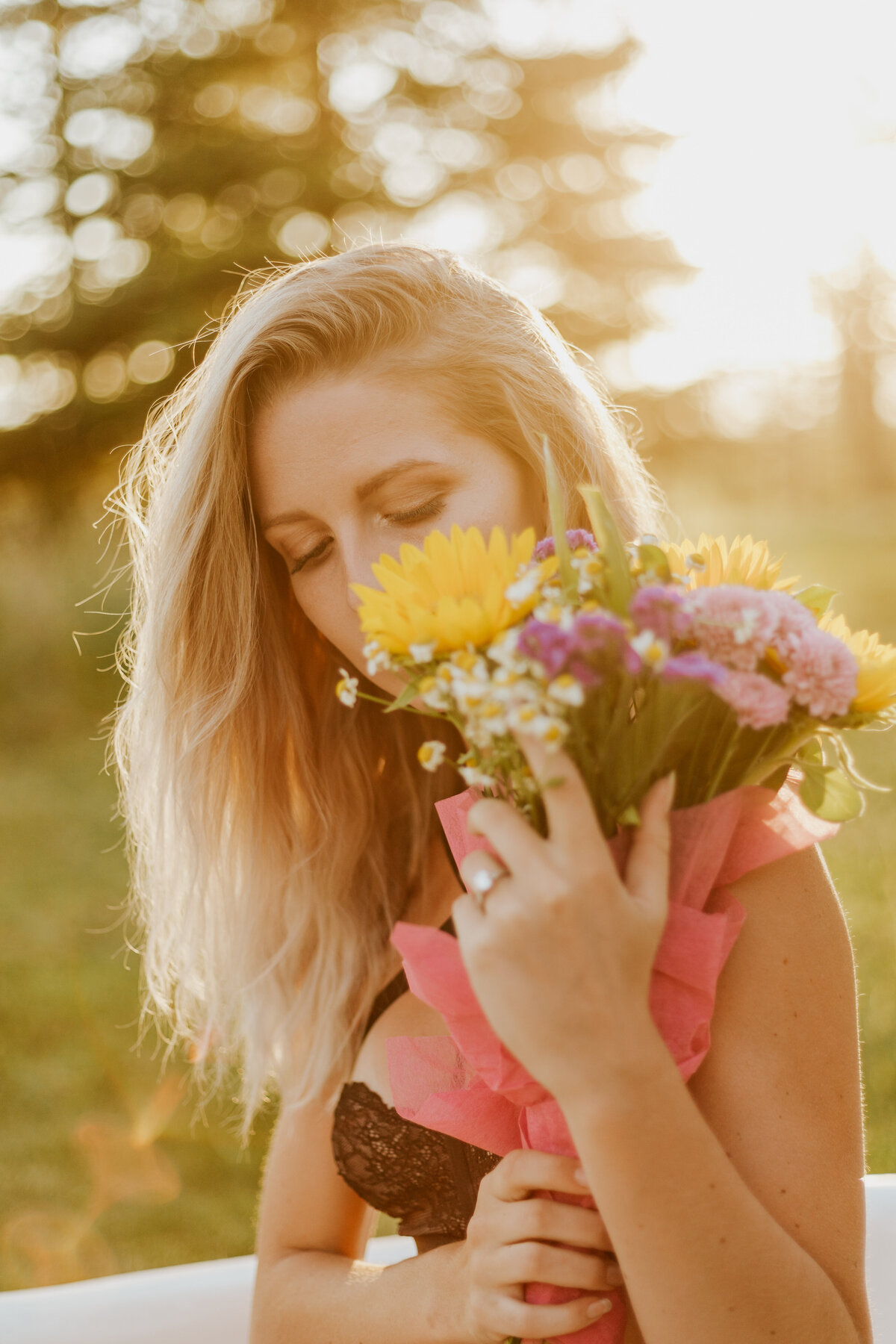 woman posing with flowers
