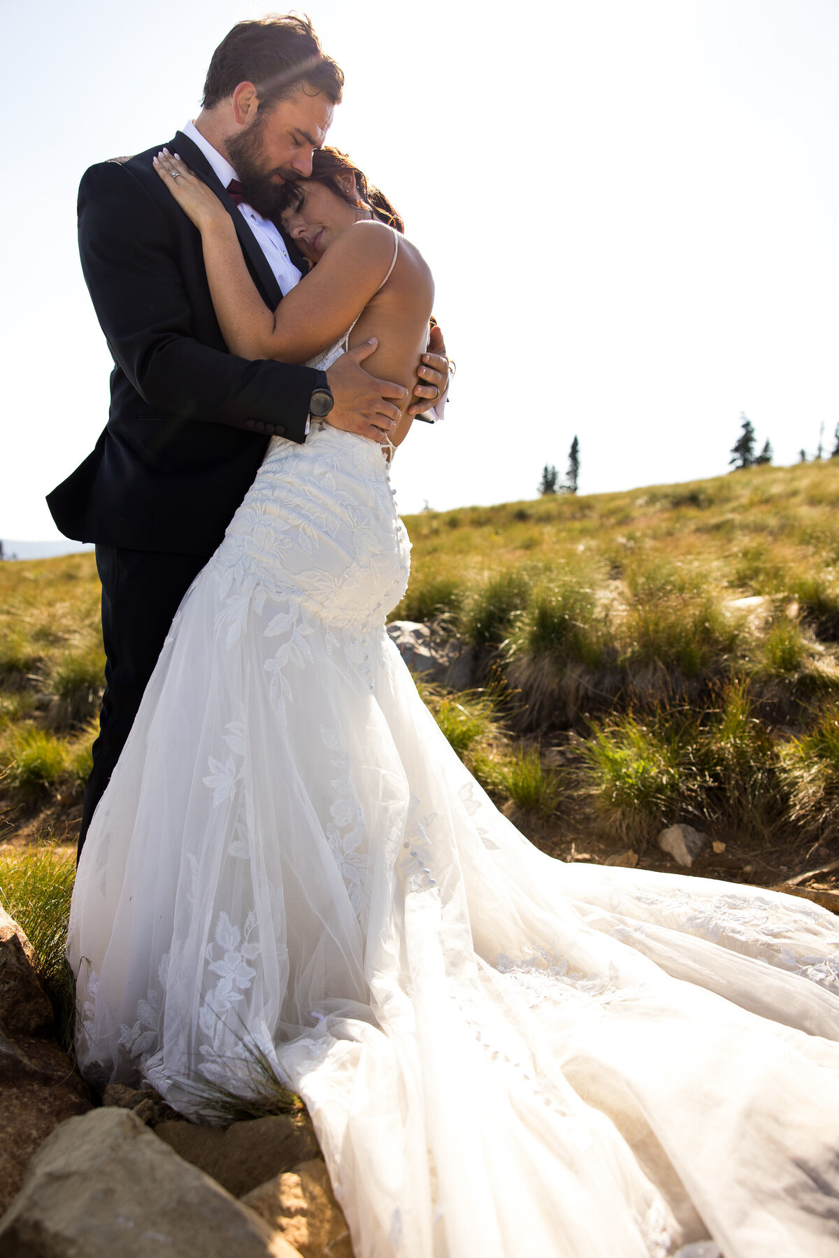 A bride and groom share a moment on top of a mountain at Schweitzer Mountain Resort near Sandpoint, Idaho after their wedding ceremony.