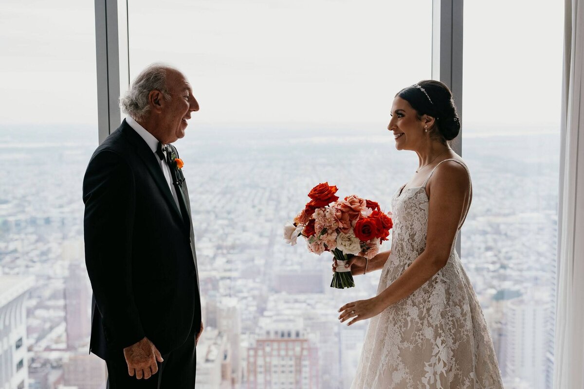 Father of the bride first look, bride holding bridal bouquet by Philadelphia Florist Sebesta Design