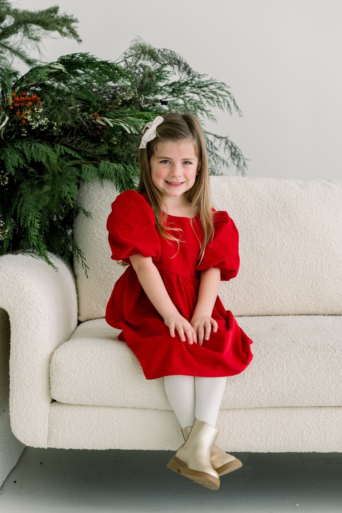 Little girl wearing red christmas dress