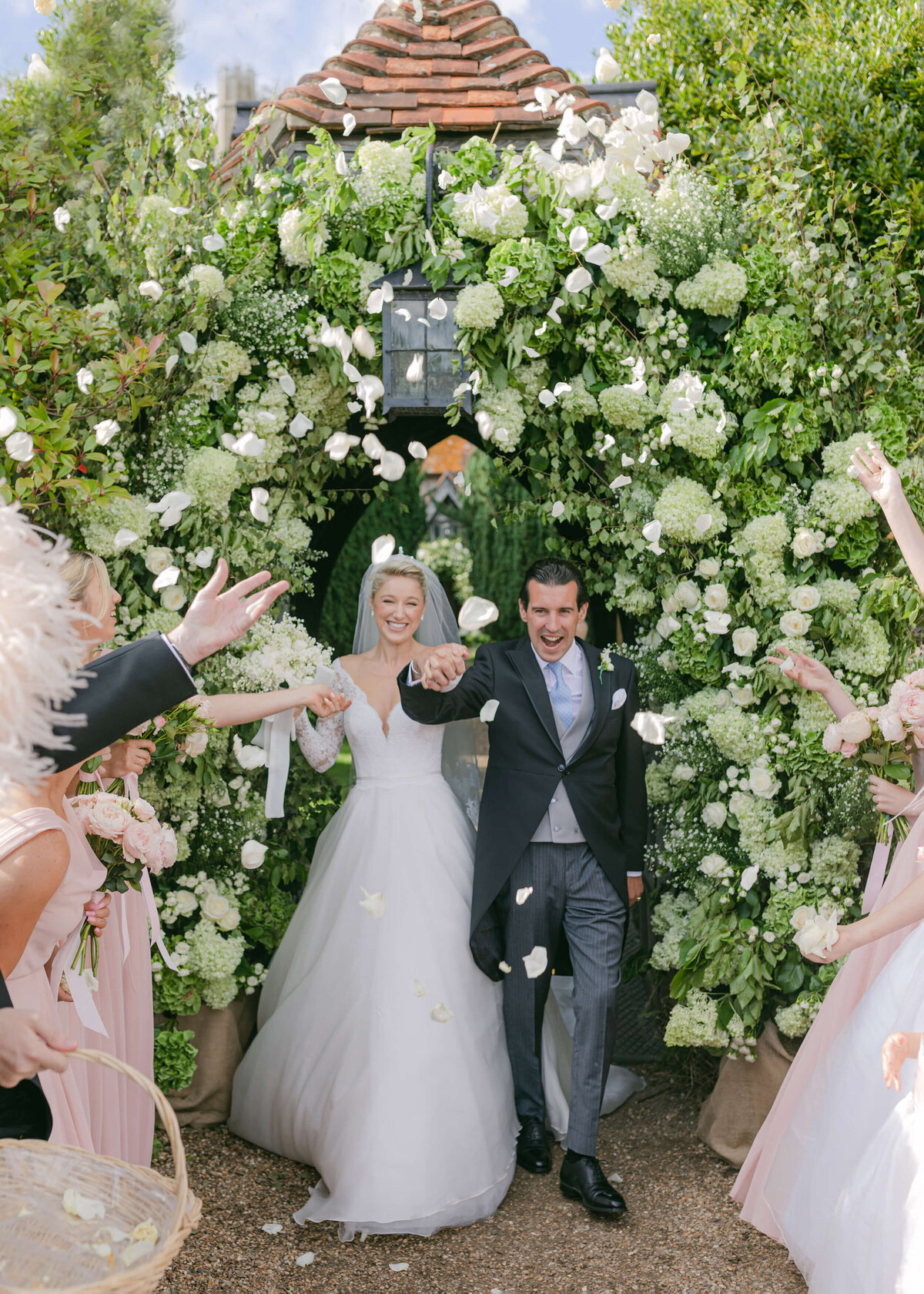 chloe-winstanley-weddings-hambleden-church-flower-arch-confetti