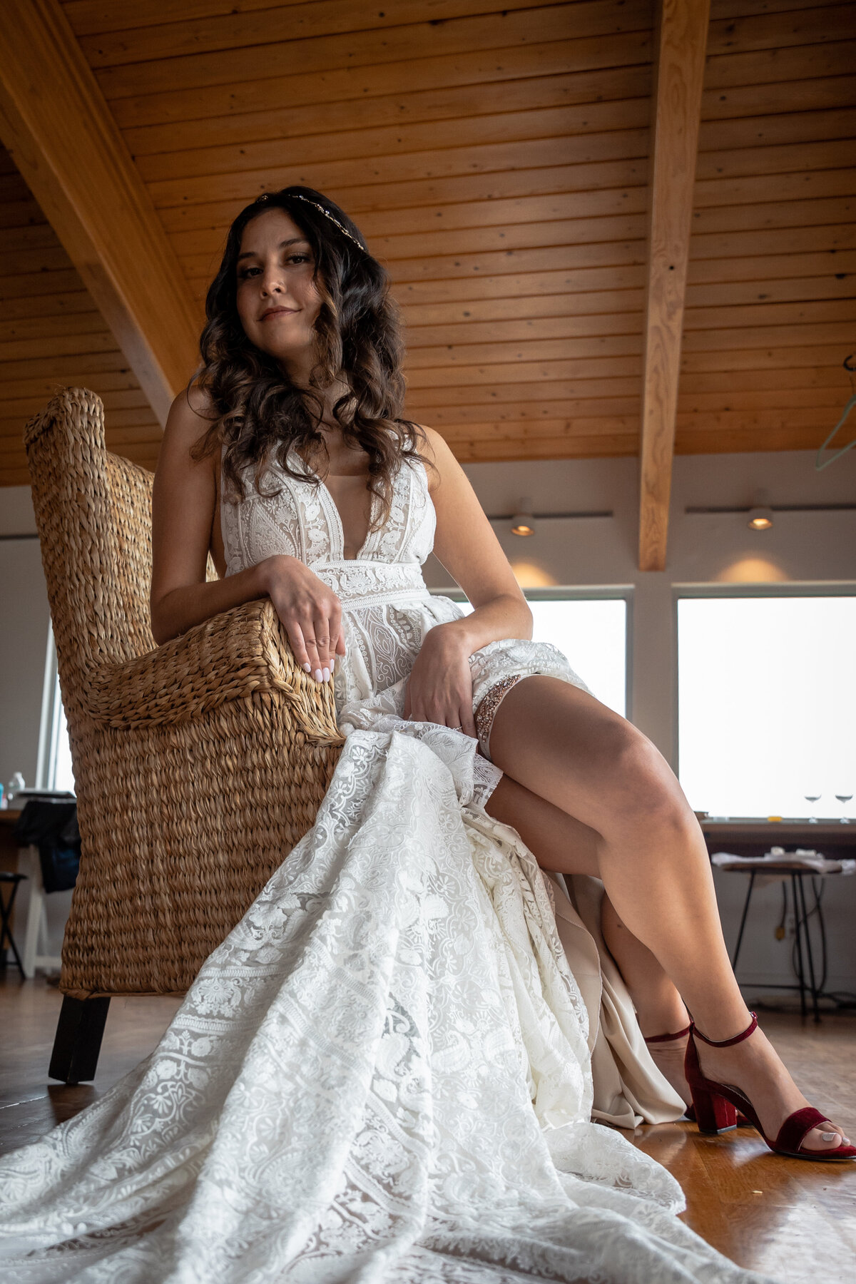 Photograph of a bride in a chair at Saltwater Farm Vineyard in Stonington Connecticut.