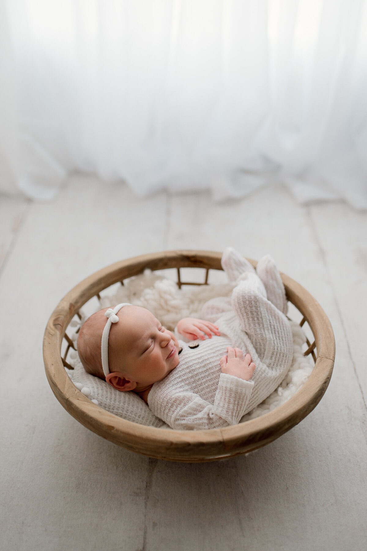 Baby posed in basket newborn session near Toledo Ohio