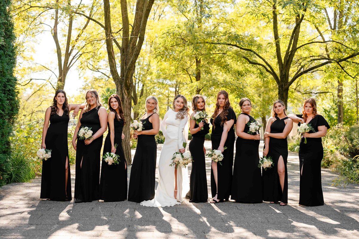 Bridemaids line up wearing black at Lurie Garden