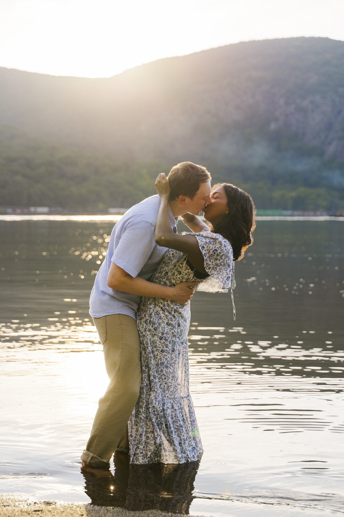Couple kissing in the Hudson River at sunset during Hudson Valley engagement photos
