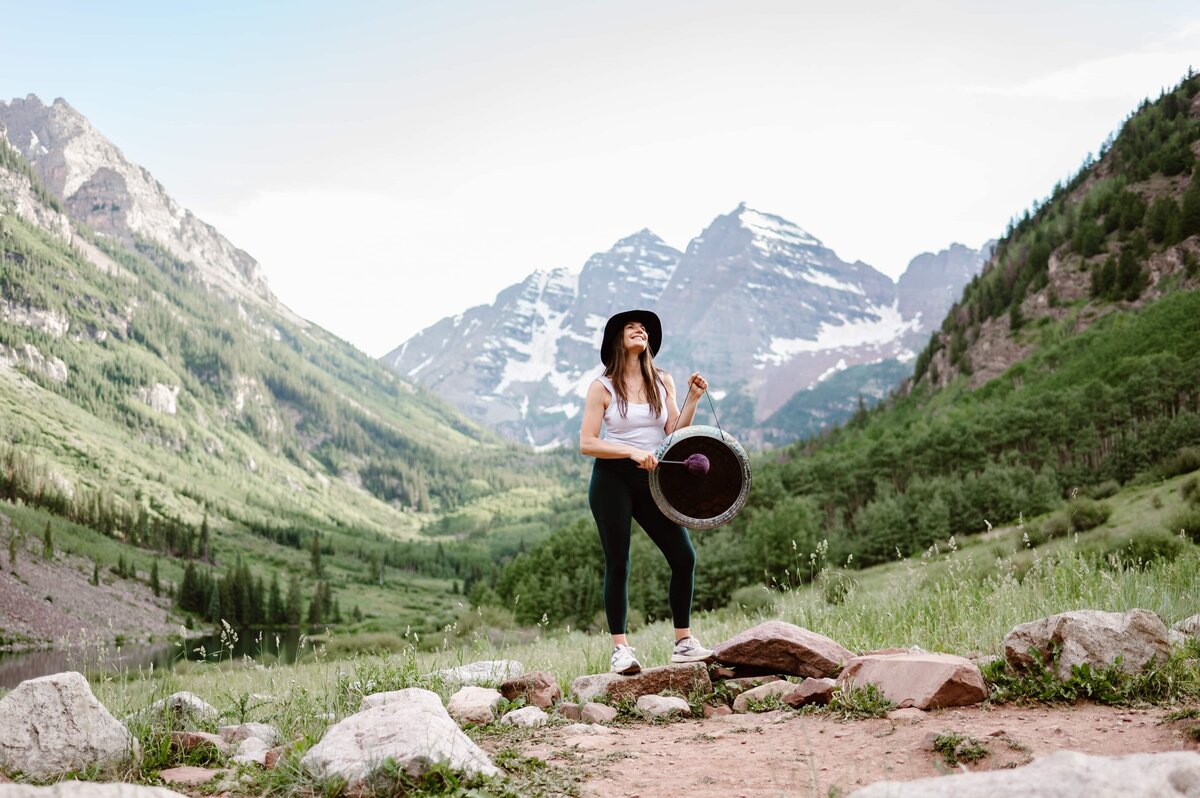 Professional Colorado branding headshot with scenic mountain backdrop for personal brand