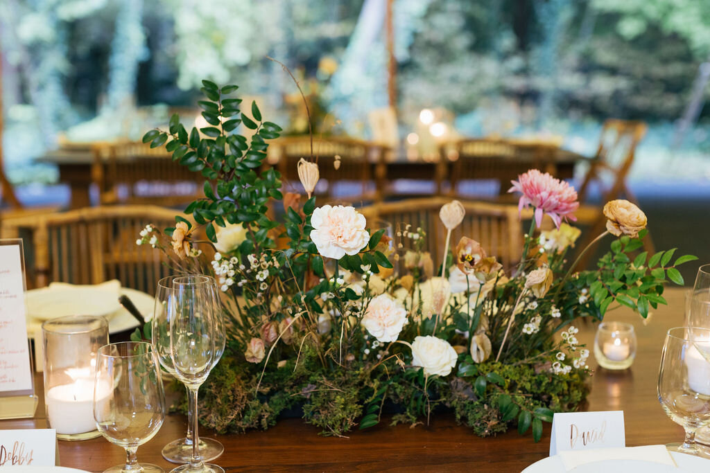 Romantic autumn floral centerpiece with candles, garden roses and lush natural greenery. Wedding floral design at RT Lodge by Rosemary and Finch in Nashville, TN.