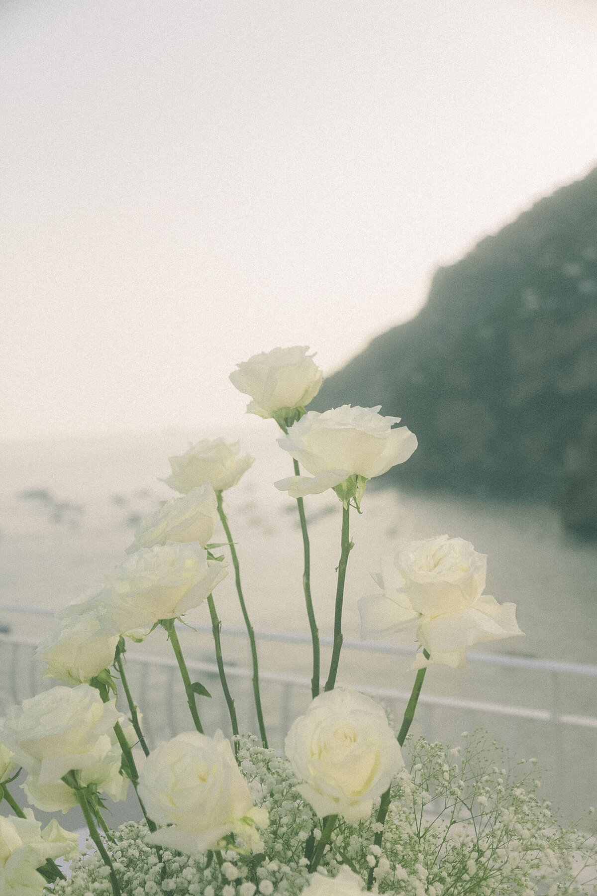 Close-up of wedding flowers by Europe-wide photographer at Italian coastal ceremony