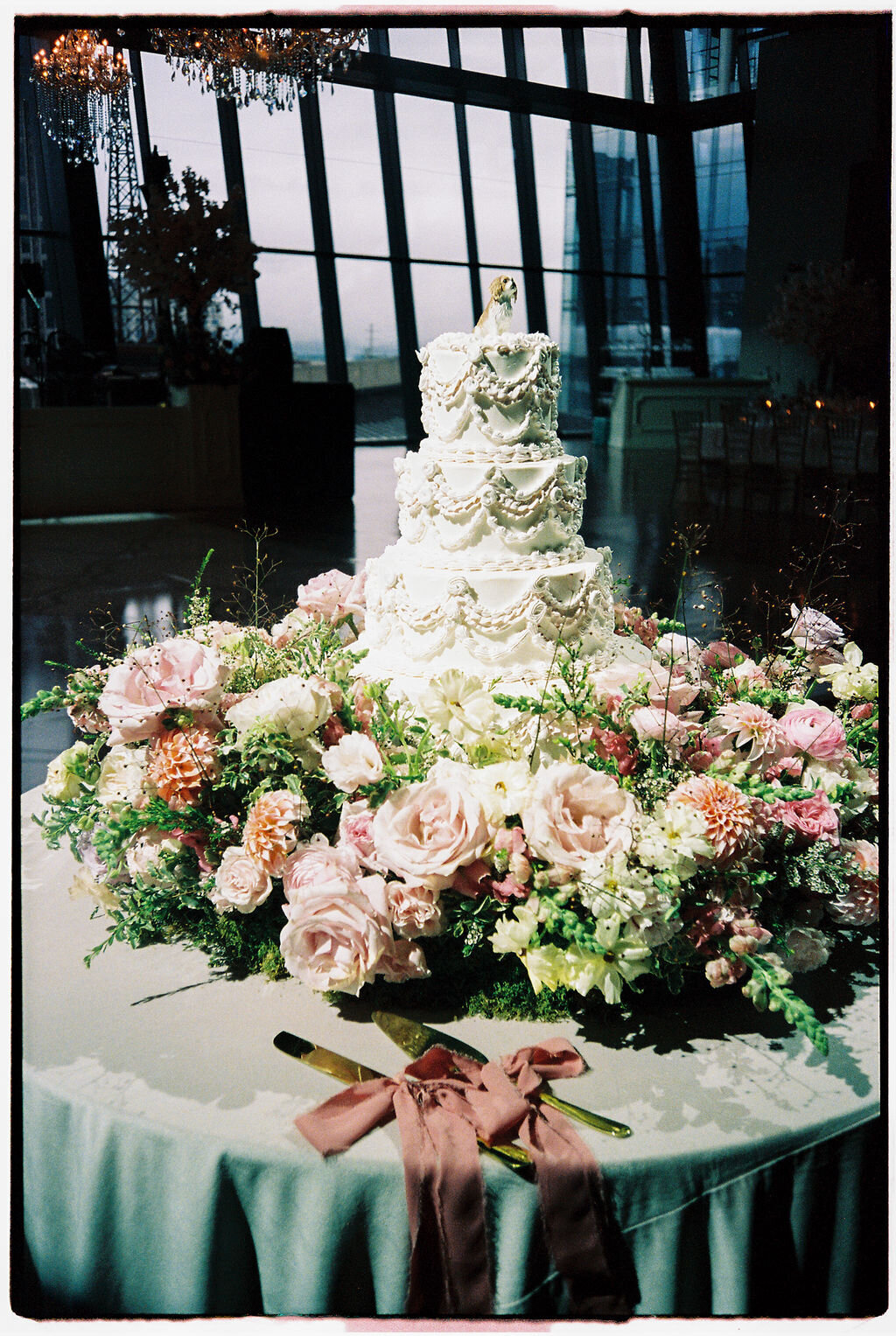 vintage pastel wedding cake with fresh flowers