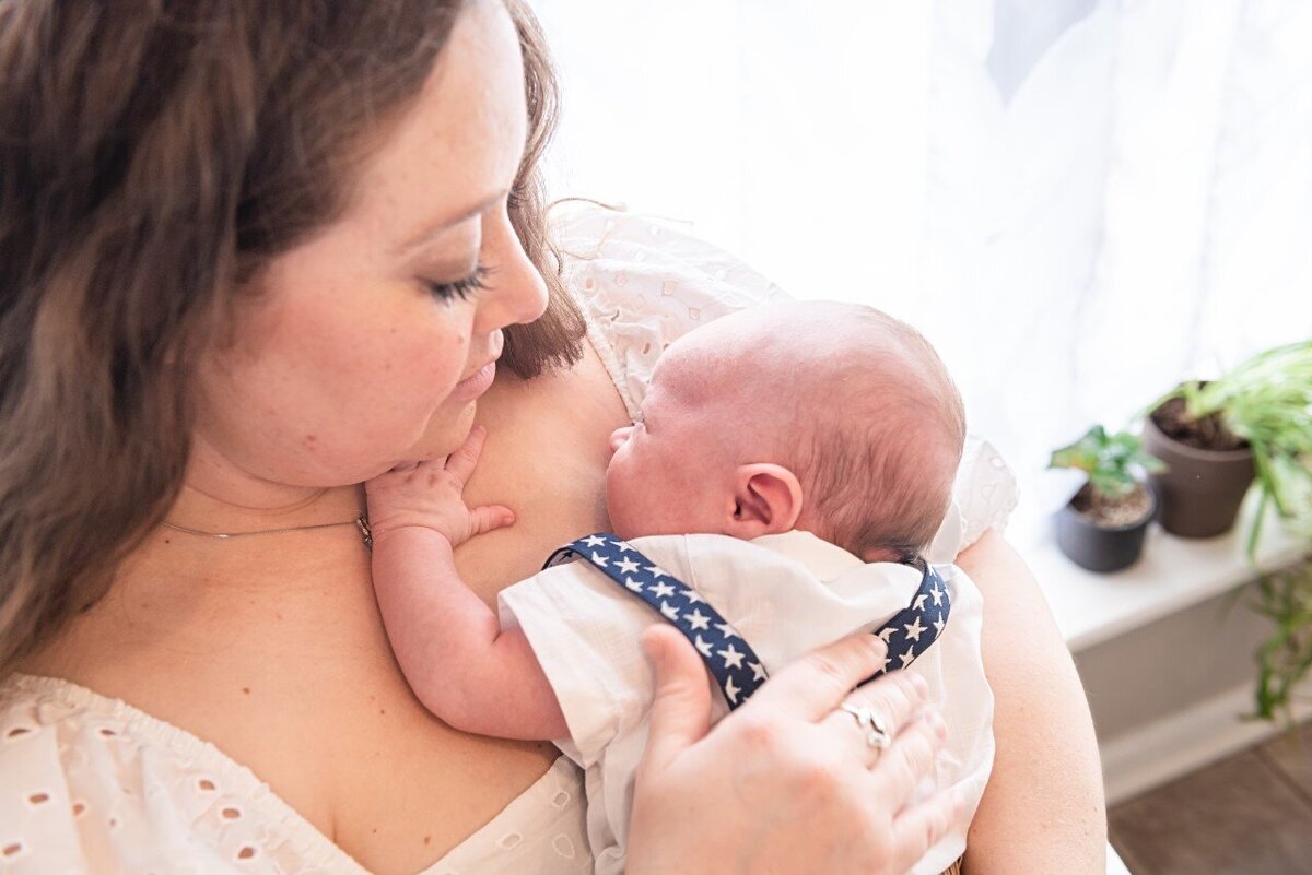 newborn boy with mom holding him