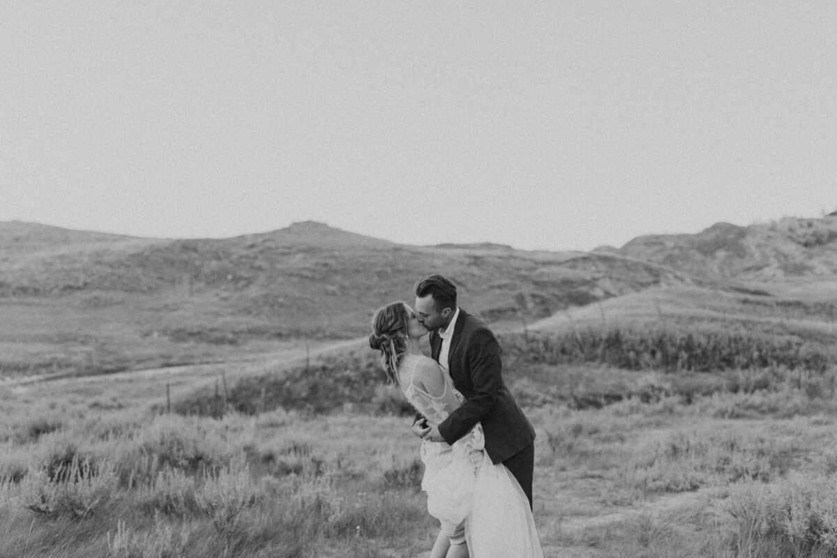 groom holding bride's shoulders