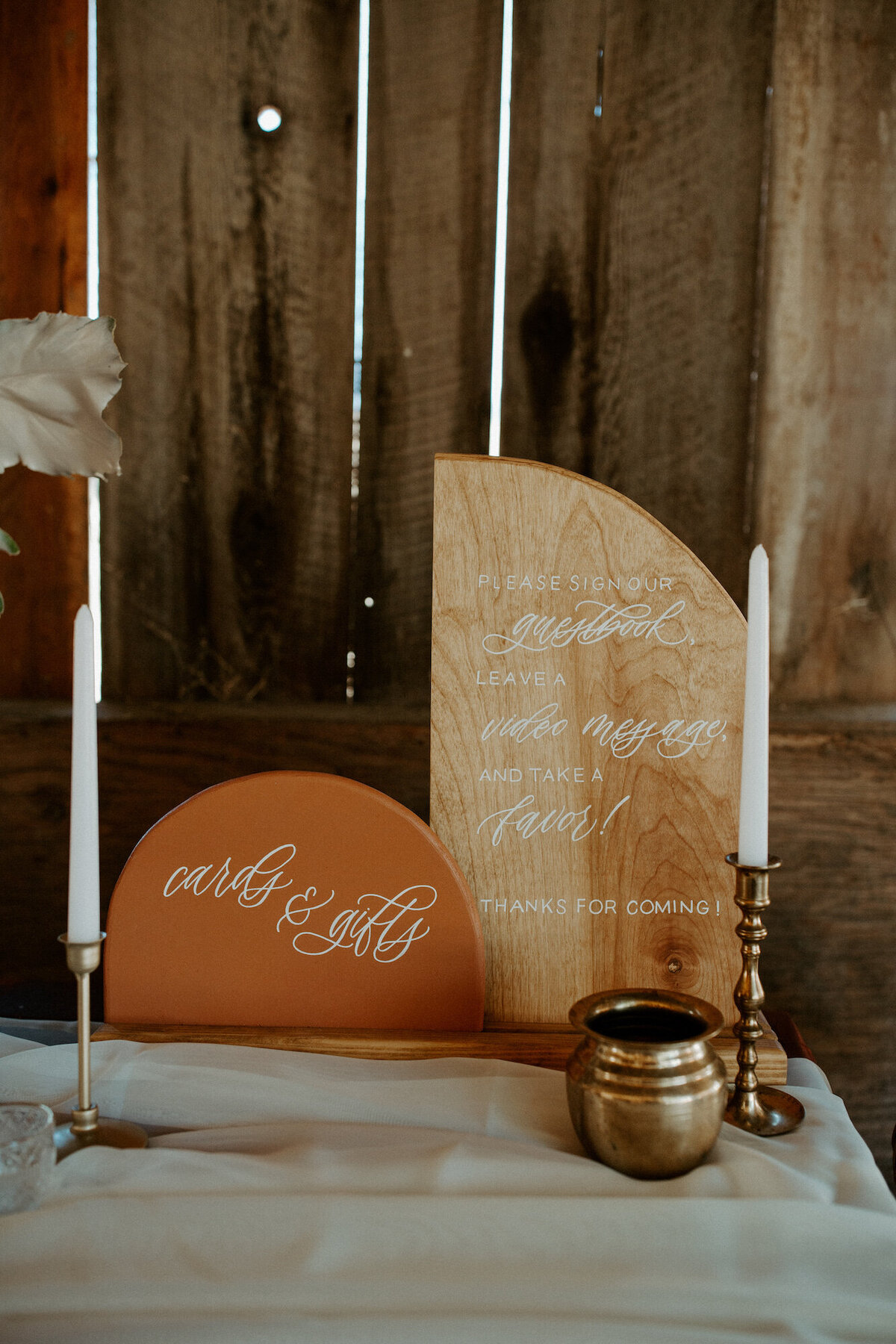 Welcome table signage in wood and terra cotta,  arched wood pieces for cards and gifts and guestbook
