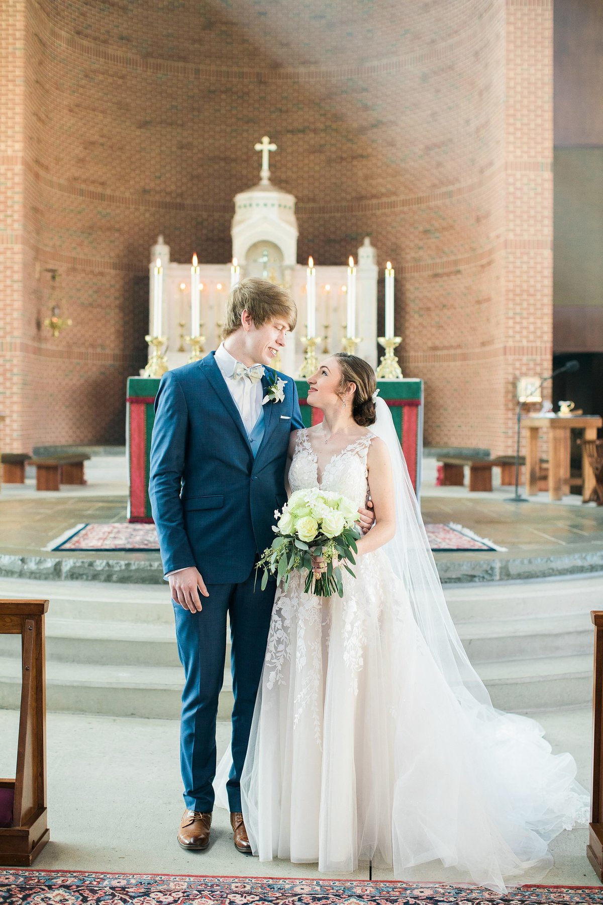 Wedding Photographer, couple standing together inside church