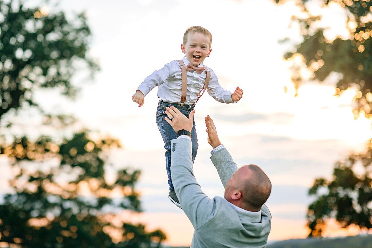 Dad tossing son into the air near Harrisonburg, VA