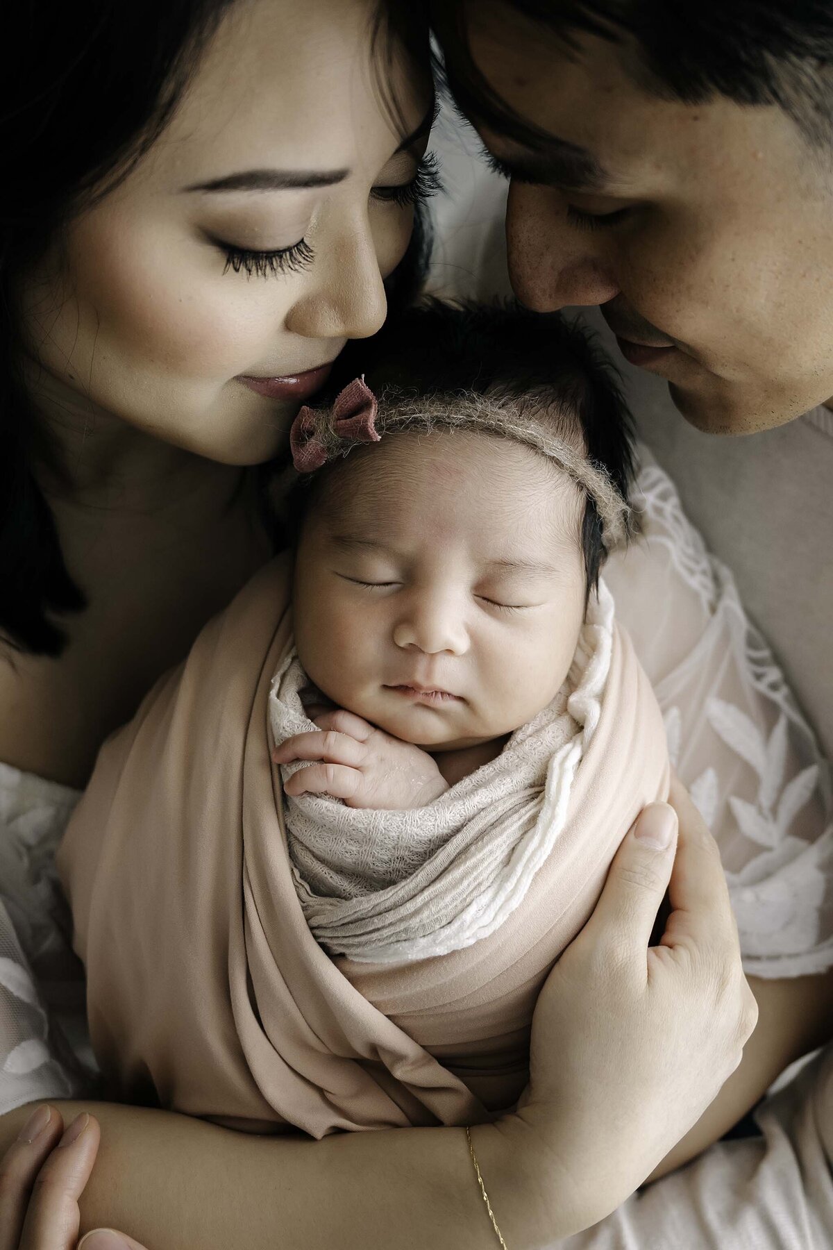 Mom and Dad with Baby Girl - Newborn Studio Session