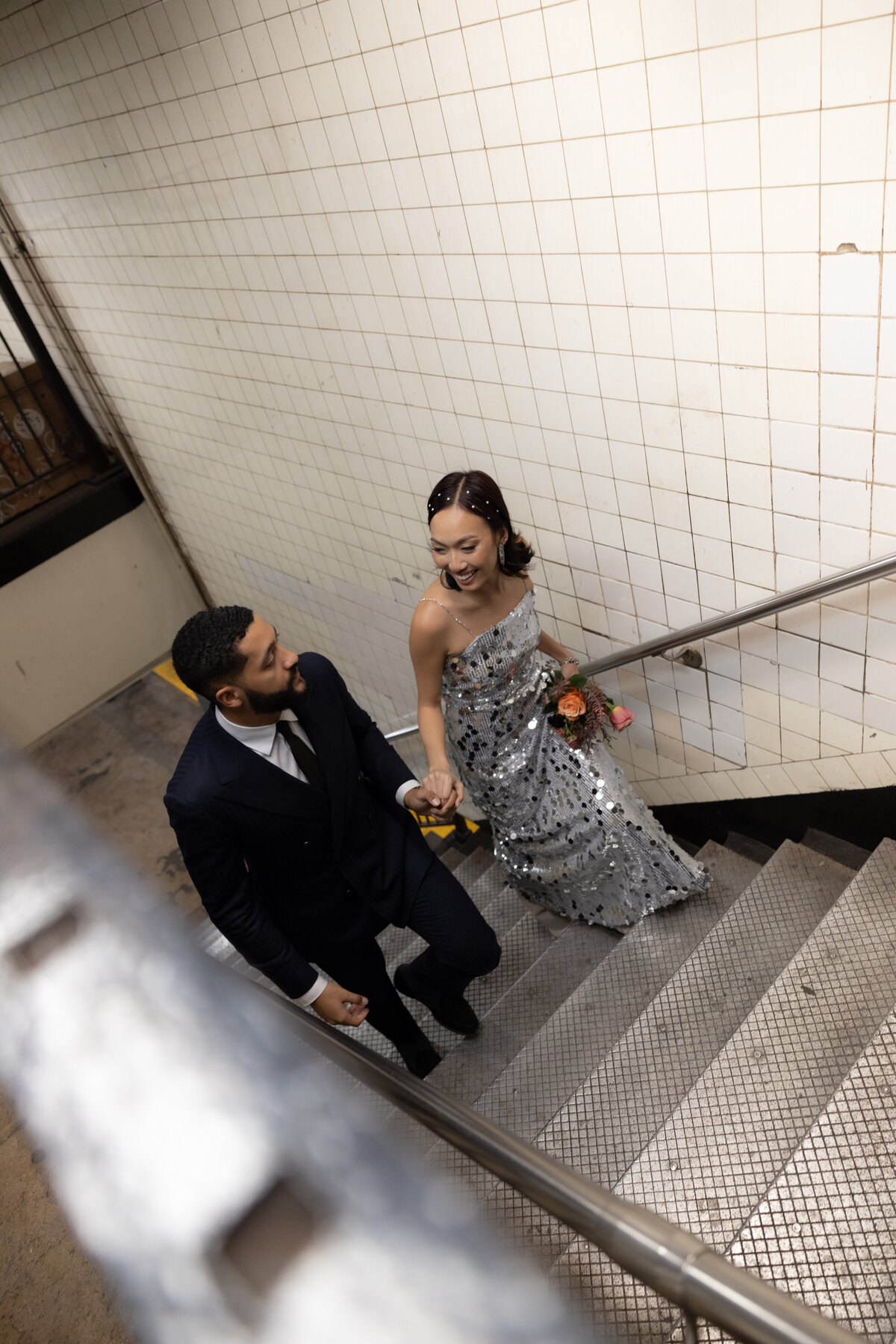 Modern, urban editorial elopement session on the NYC subway, capturing bold style and romantic vibes.