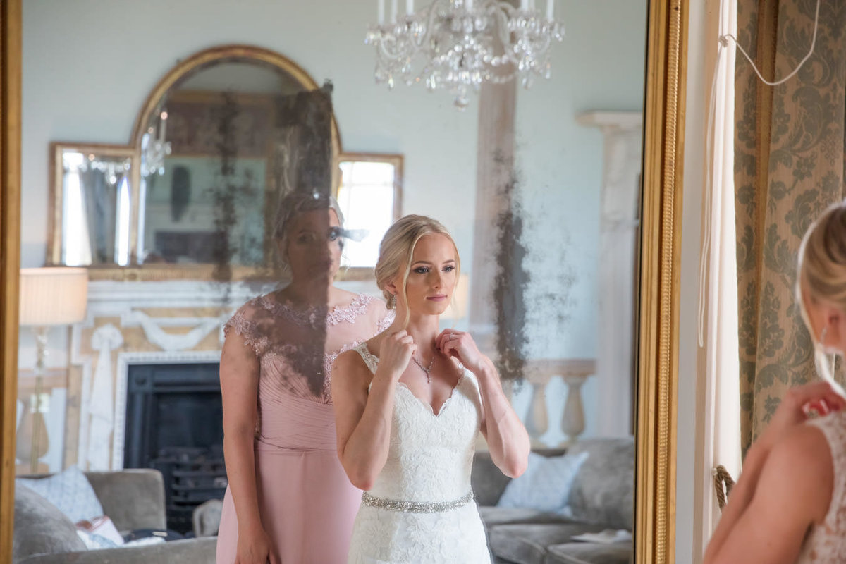 Bride in mirror at Rockbeare Manor Devon