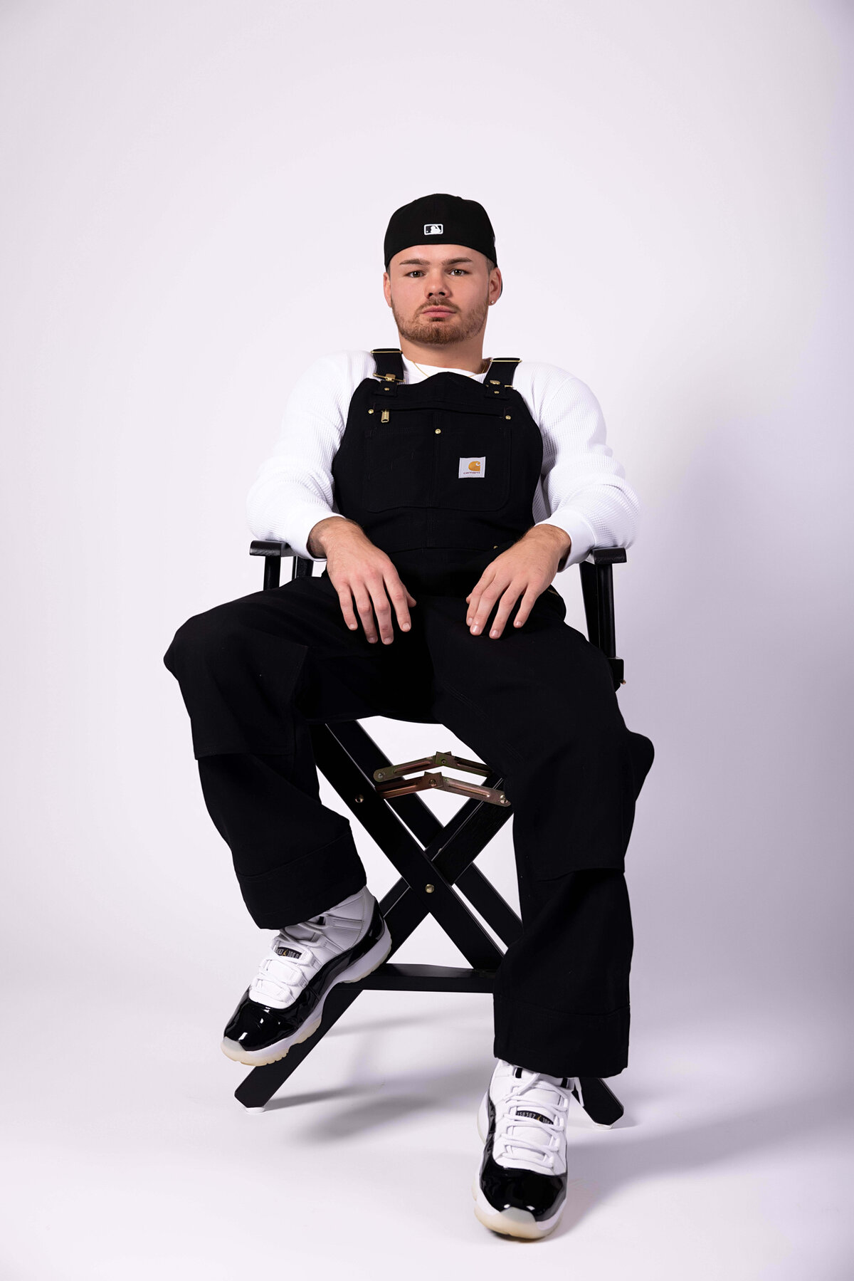 Professional boxer sitting in chair in birthday session with Reva Davis photography