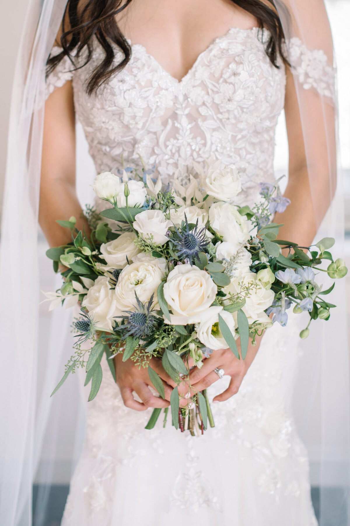 Classic and elegant bouquet  of white and blue by Bright and romantic orange, pink and white bouquet by Lovella Lifestyle, whimsical and romantic Edmonton wedding florist, featured on the Brontë Bride Vendor Guide.