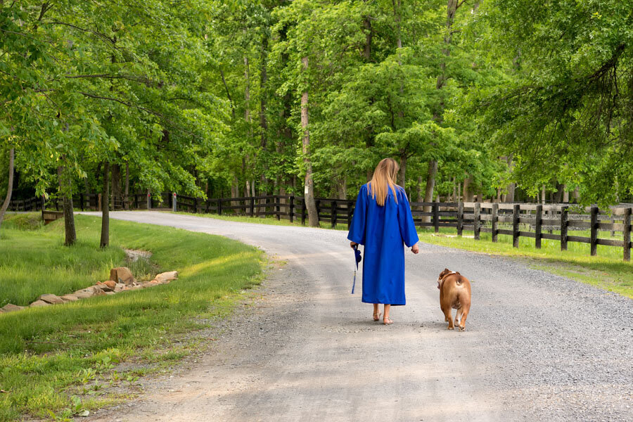 senior cap and gown and dog
