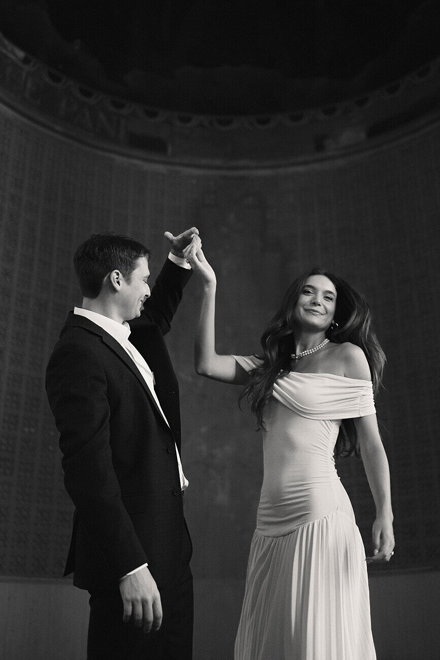 Couple dancing inside Hotel Peter and Paul Chapel in black and white