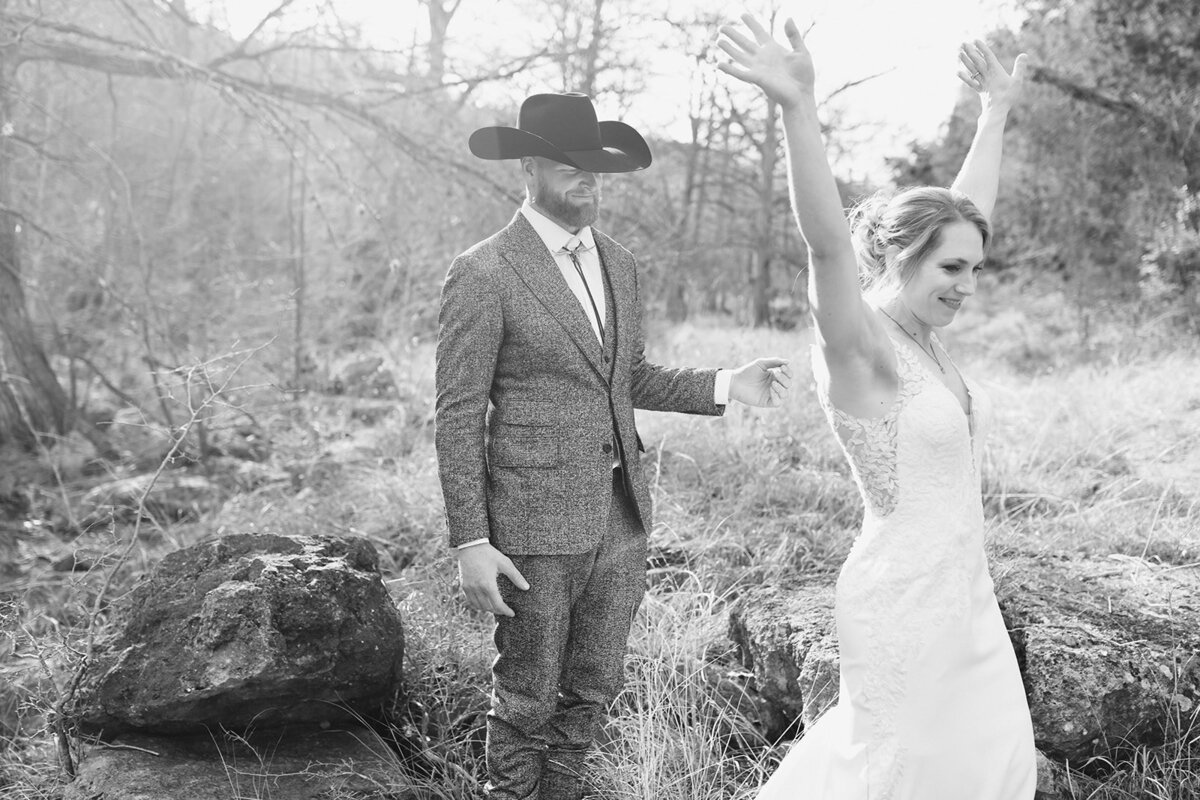 groom in cowboy hat with bride