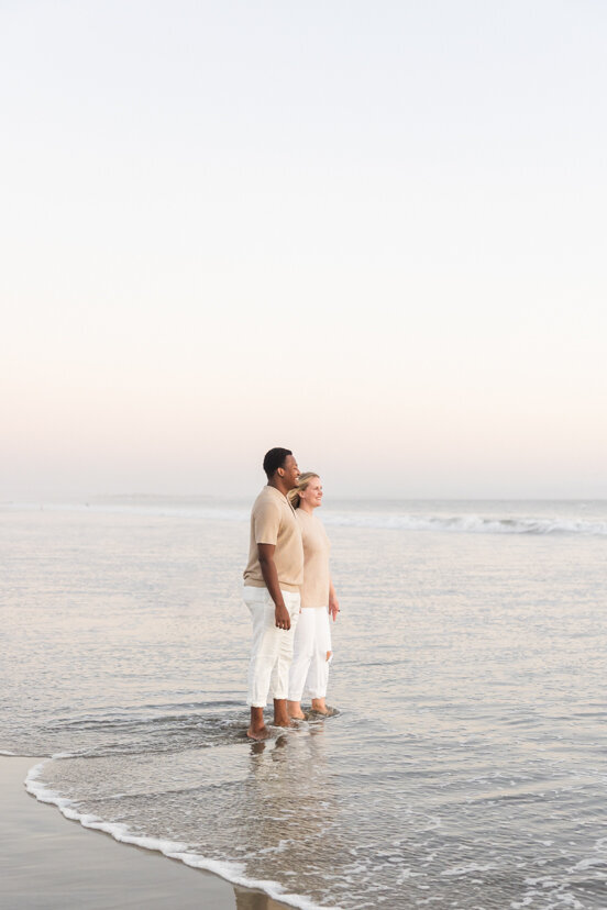 couple-on-Coronado-beach-san-diego-looking-at-ocean