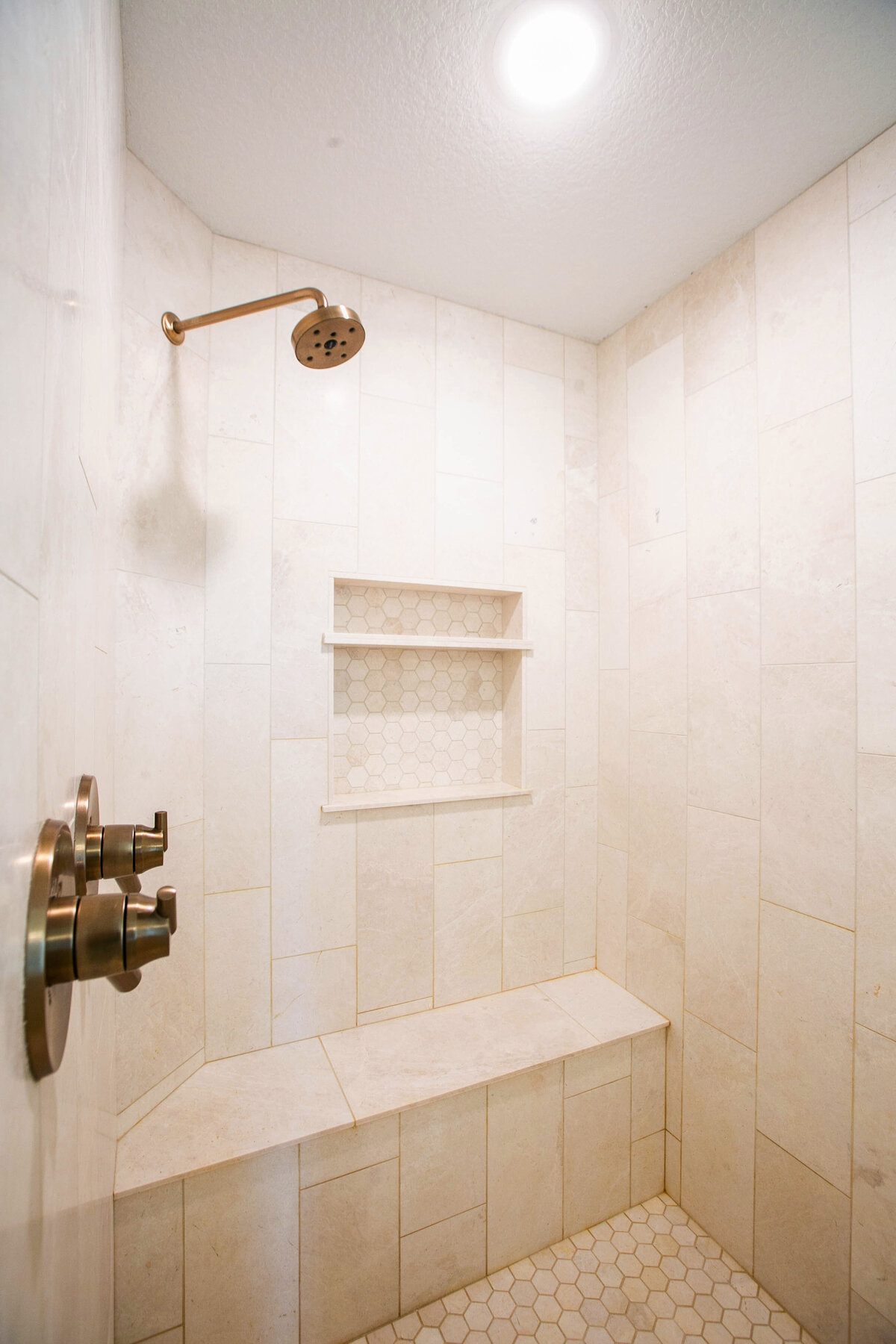 Custom bathroom with soaking tub, double vanity, and walk-in shower in Otsego custom home