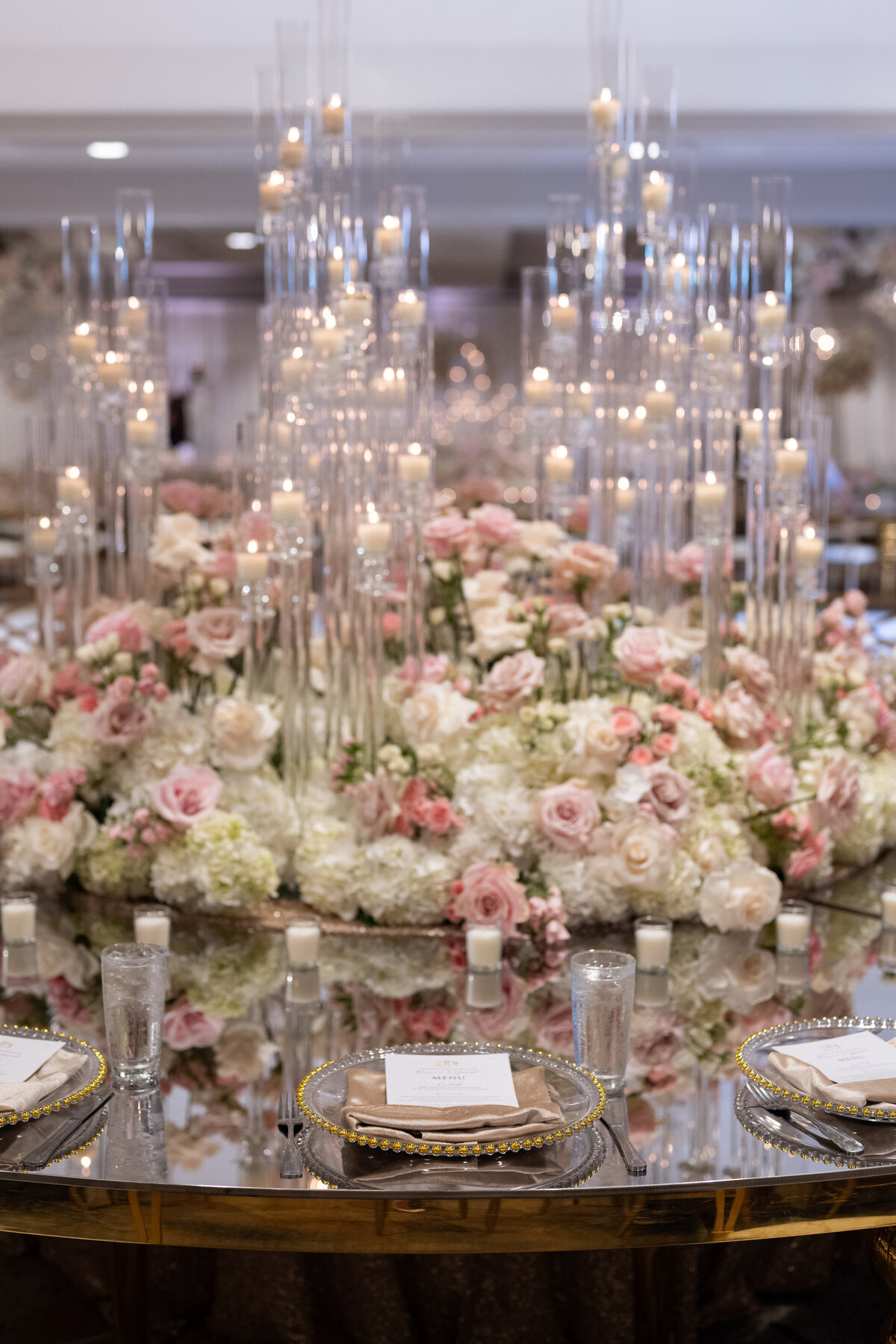 A large floral arrangement on a reception table