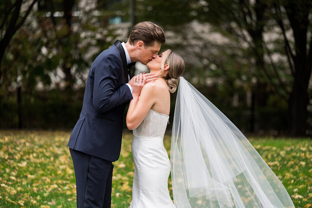 bride and groom kissing for the first time