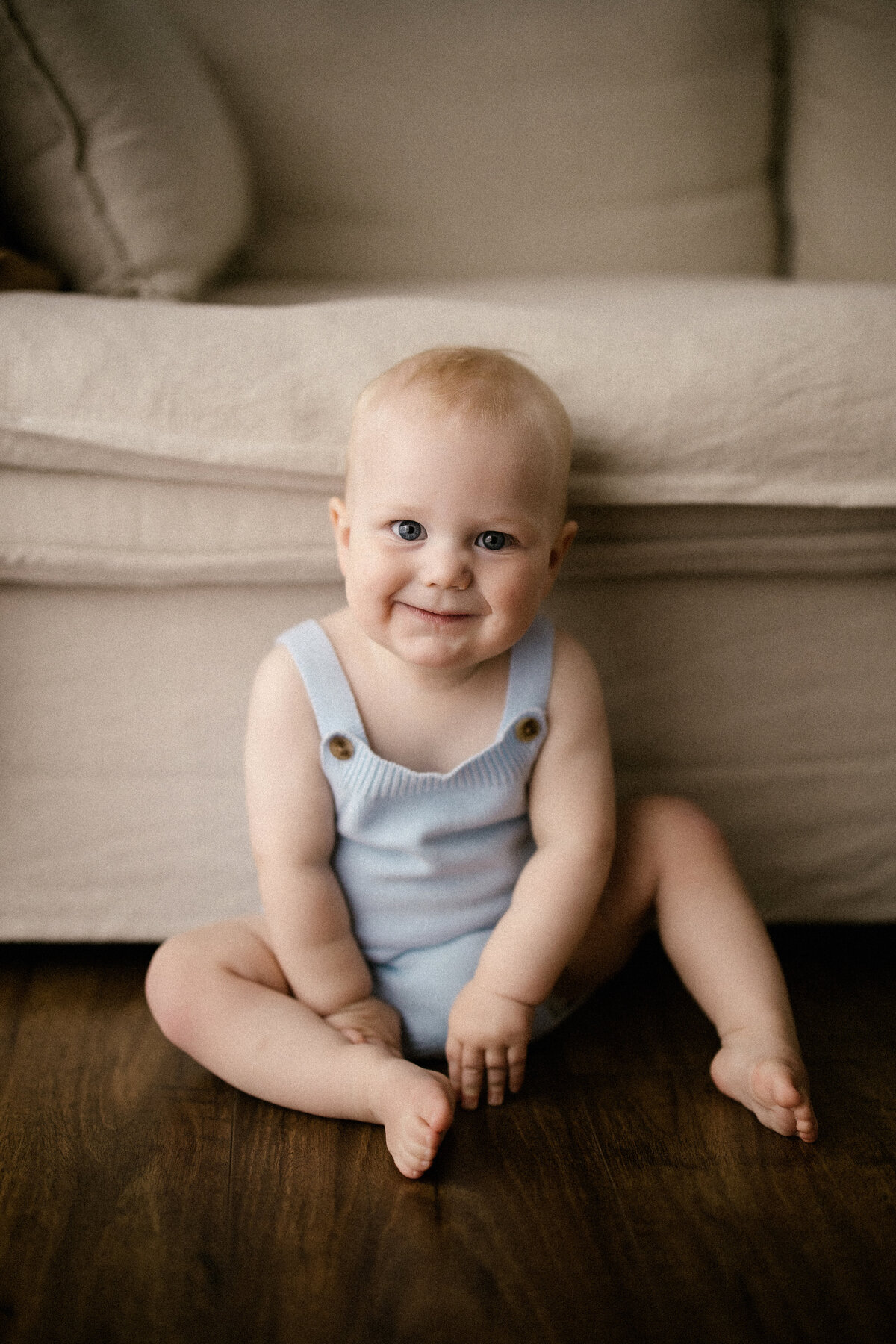 A little baby named oscar poses for the camera during his milestone photoshoot with taranaki photographer aimee kelly photography