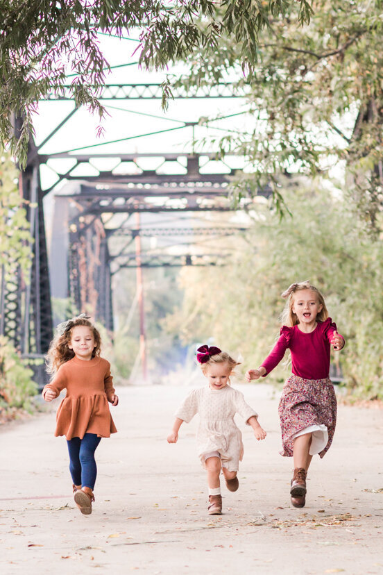 three-girls-running-on-sweetwater-river-bridge-san-diego