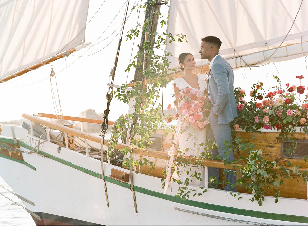 Kate-Murtaugh-Events-elopement-wedding-planner-Boston-Harbor-sailing-sail-boat-yacht-greenery-floral-installation-golden-hour-sunset