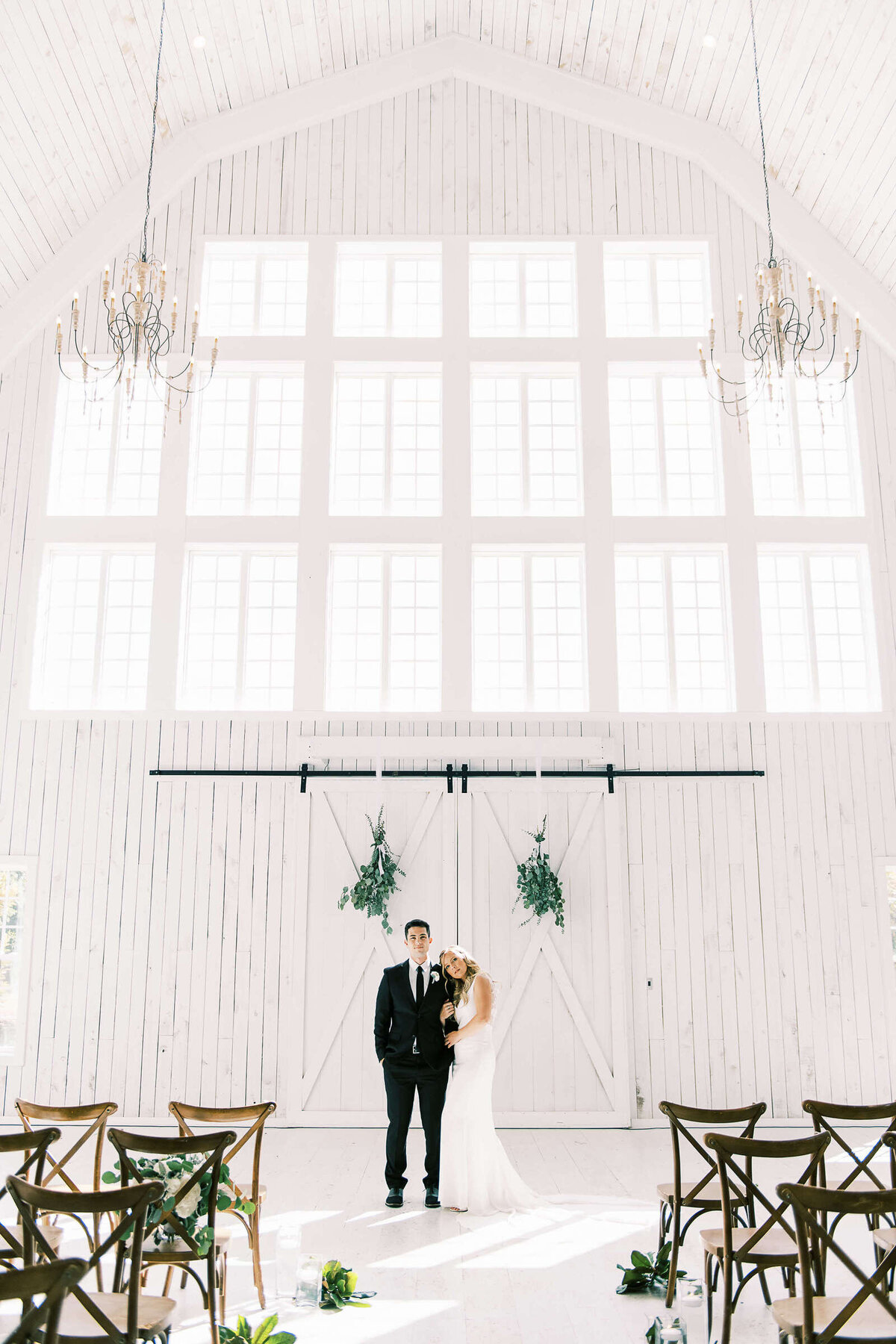 Bride and groom in light and airy The White Sparrow barn in North Texas