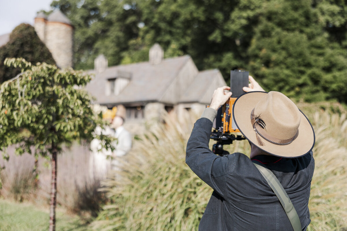 Natural Hudson Valley wedding photos with soft window light and true to life color at Blue Hill at Stone Barns with LGBTQ couple
