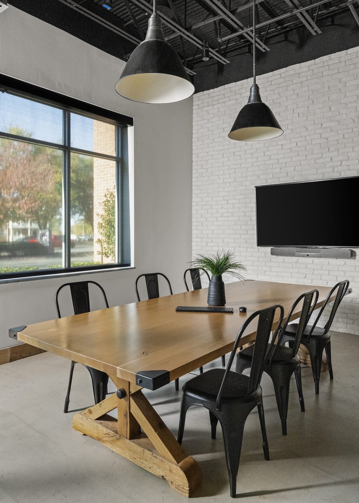 candra lynn interiors old bridge project large wooden table with white brick accent wall