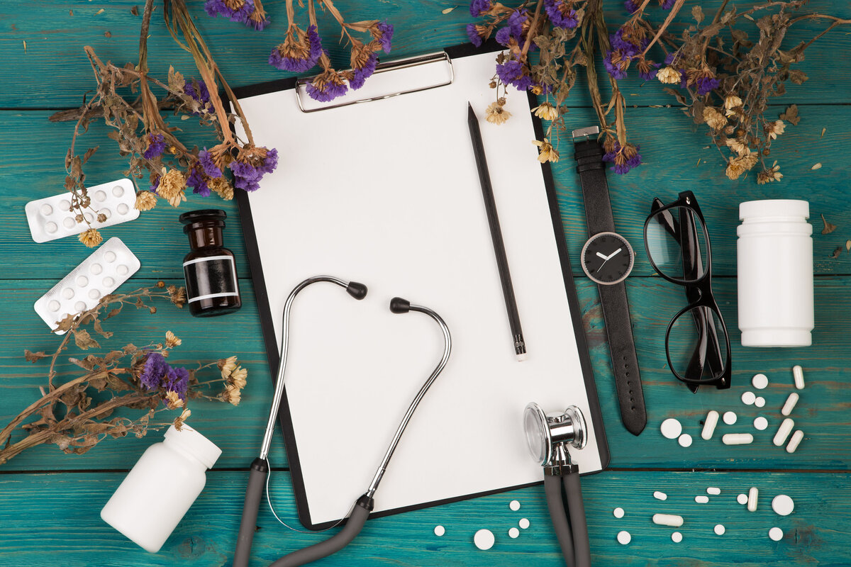Naturopathic medicine stethoscope , clipboard and herbal medicine