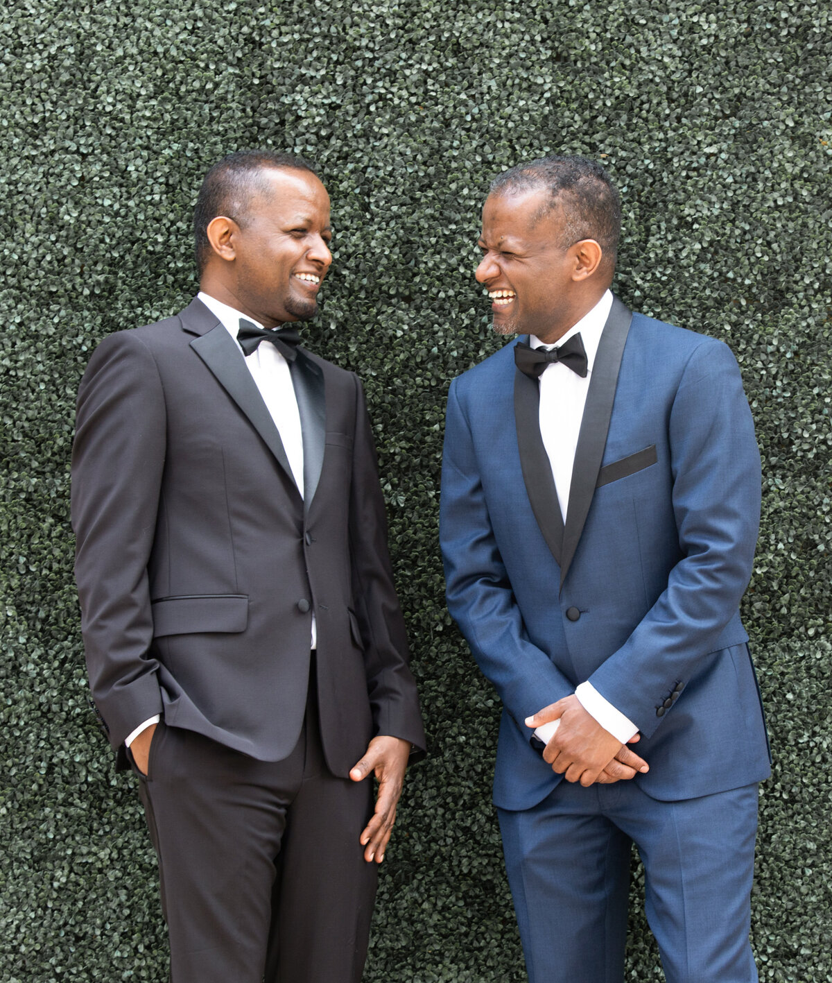 st-regis-atlanta-wedding-groom-best-man-laughing-portrait