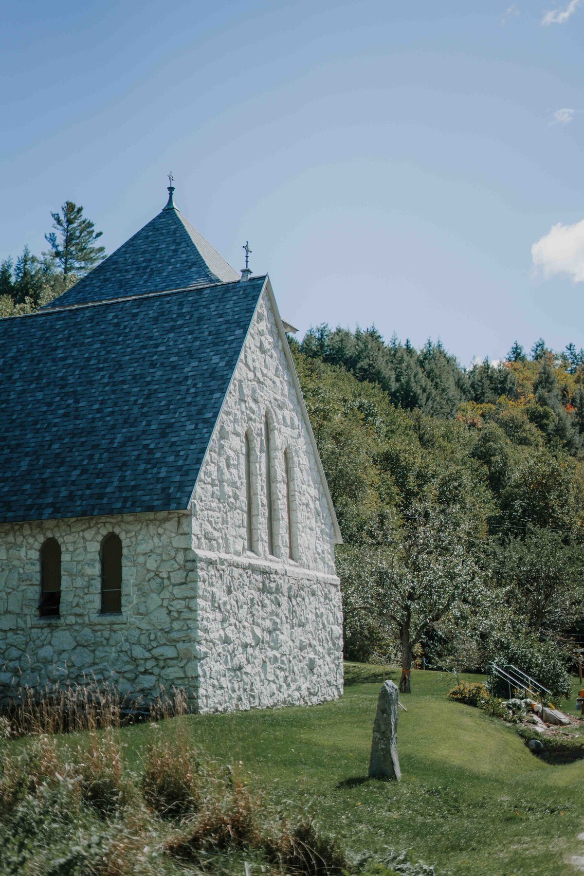 a stone church in the woods