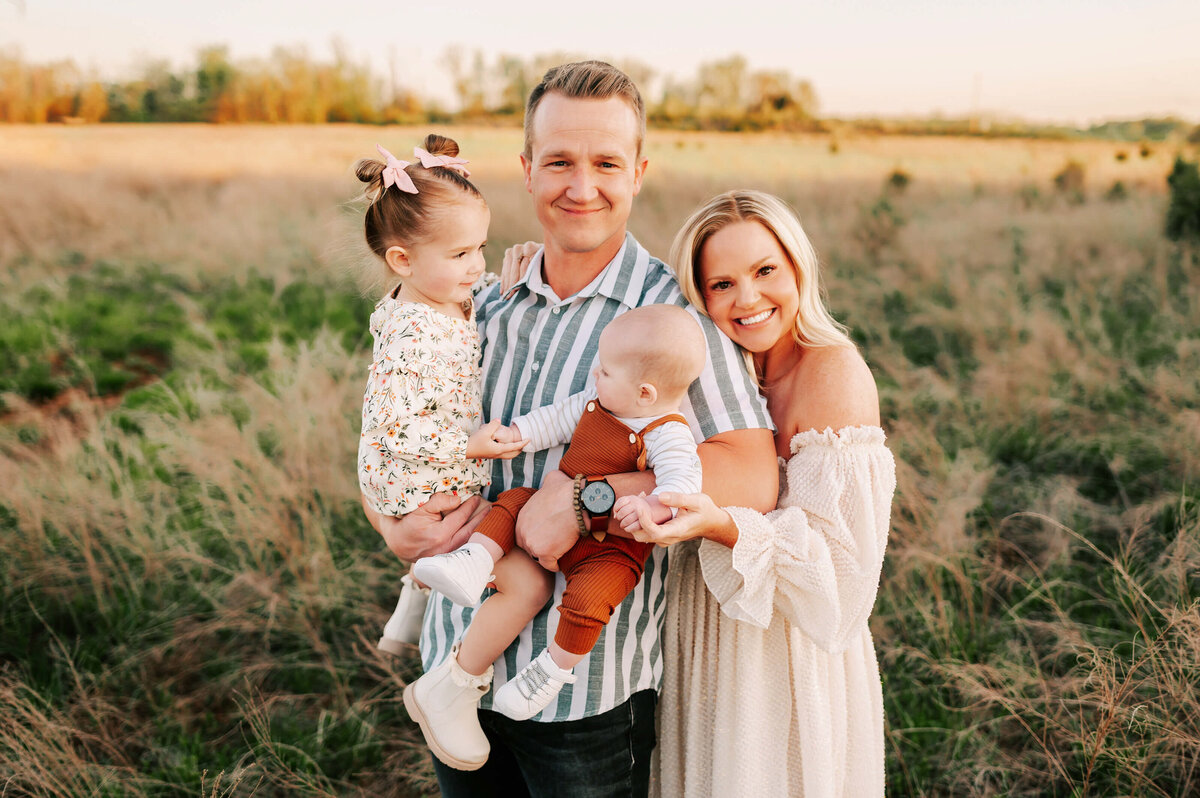 kids playing while giving family hugging during Branson MO family photography session