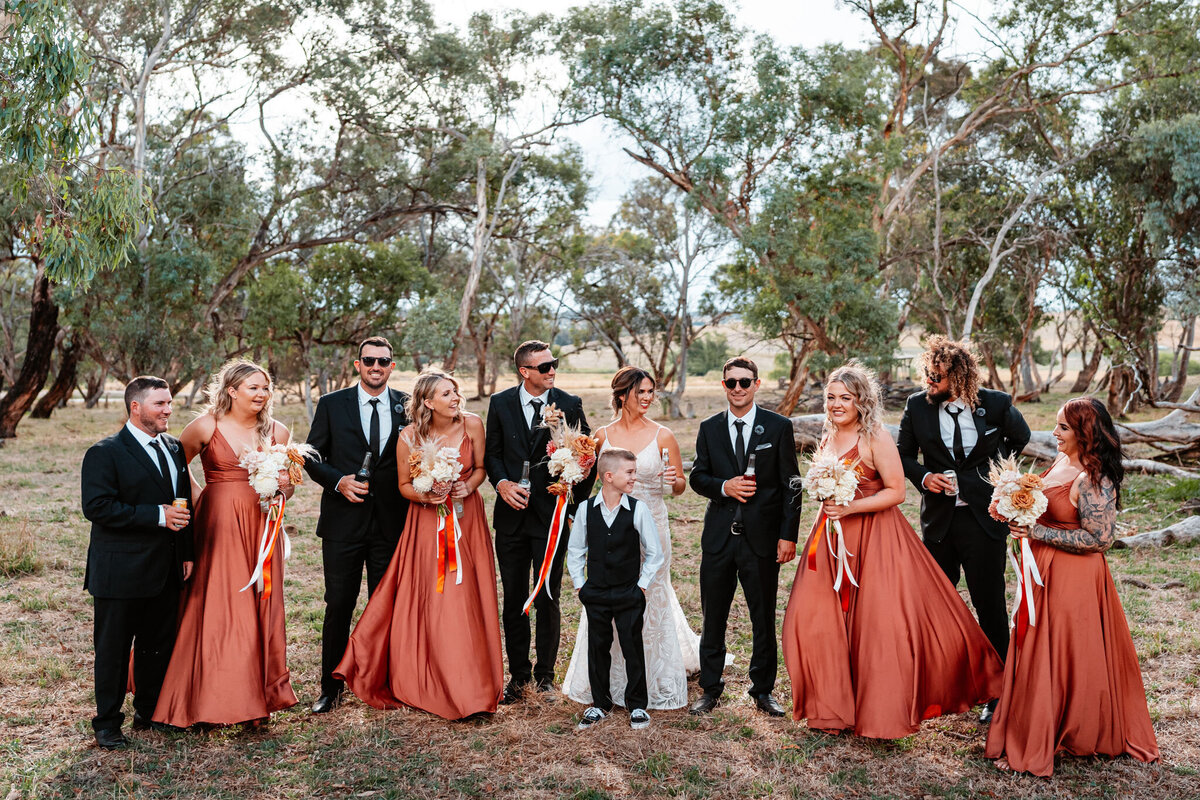 Mikaeley & Lachlan together with their groomsmen and bridesmaids having fun!